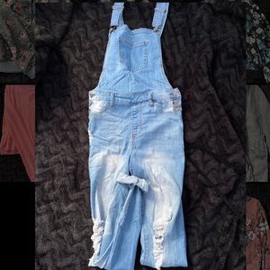 Ripped light washed denim overalls